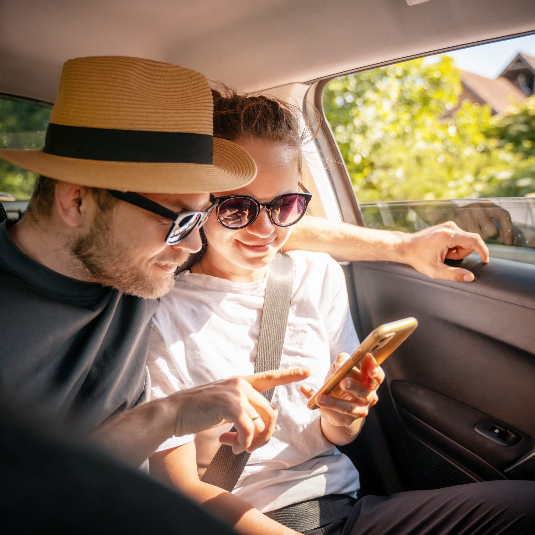 Young,Cheerful,Happy,Couple,Of,Travelers,Sitting,In,Car,Looking